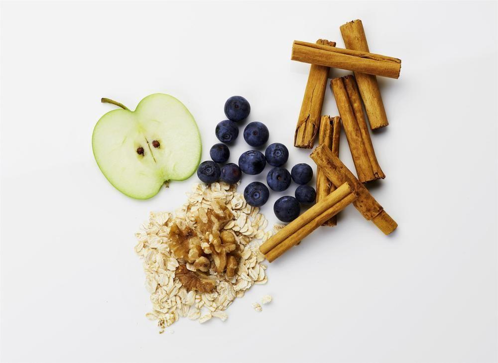 The Fullerton Hotel Sydney Eksteriør bilde The photo displays a variety of healthy food items arranged on a white background. It includes a slice of green apple, a handful of fresh blueberries, oats, walnuts, and several sticks of cinnamon. This colorful assortment highlights elements commonl
